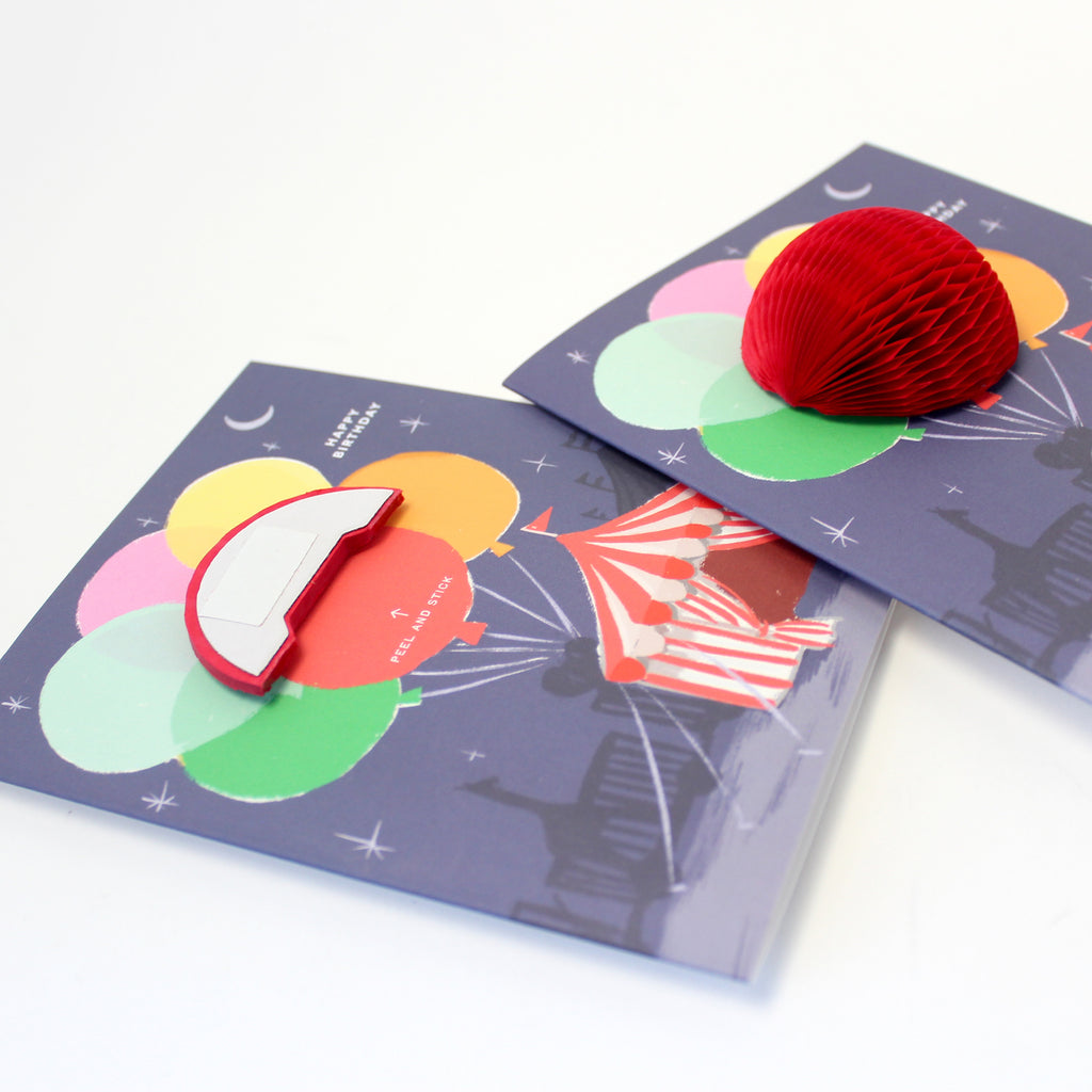 Big Top circus-themed pop-up birthday card with honeycomb balloon and a "Happy Birthday" message on the front