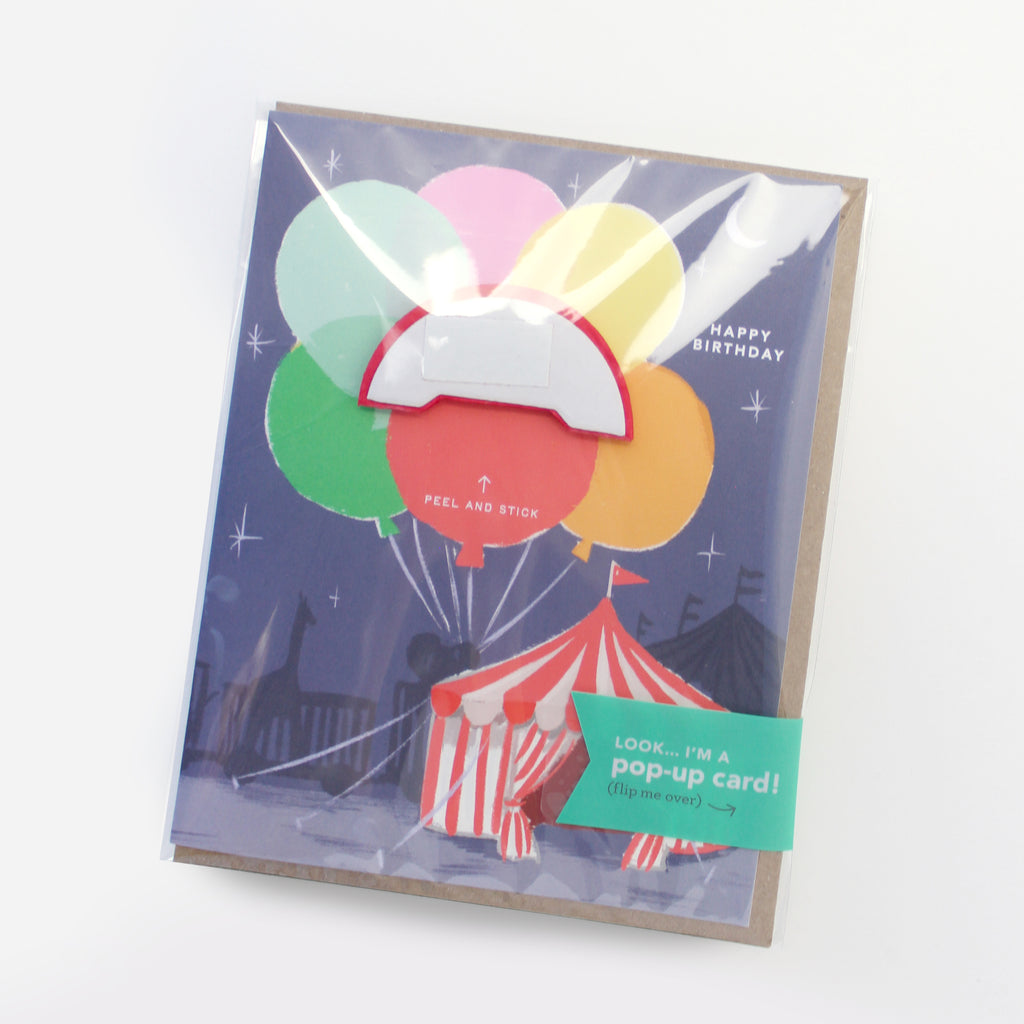 Big Top circus-themed pop-up birthday card with honeycomb balloon in its retail packaging