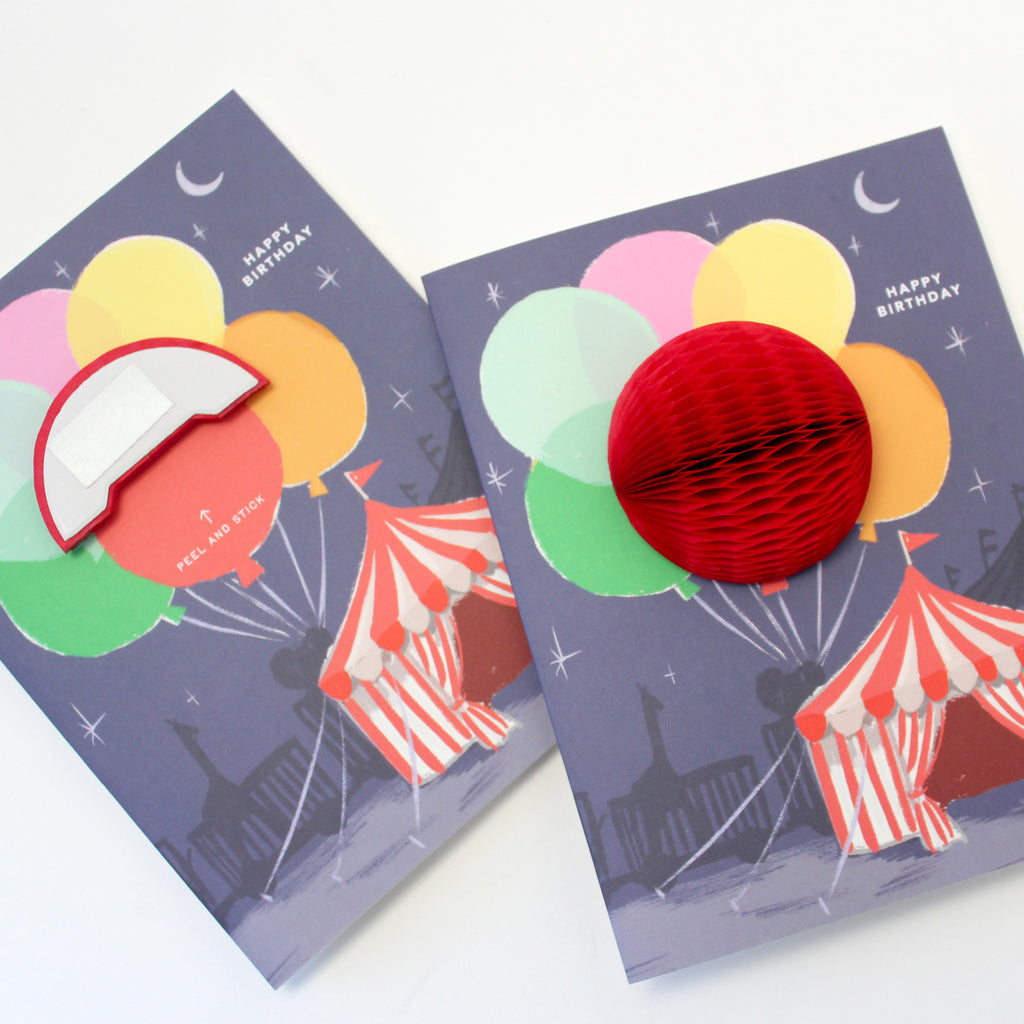 Big Top circus-themed pop-up birthday card with honeycomb balloon and a "Happy Birthday" message on the front