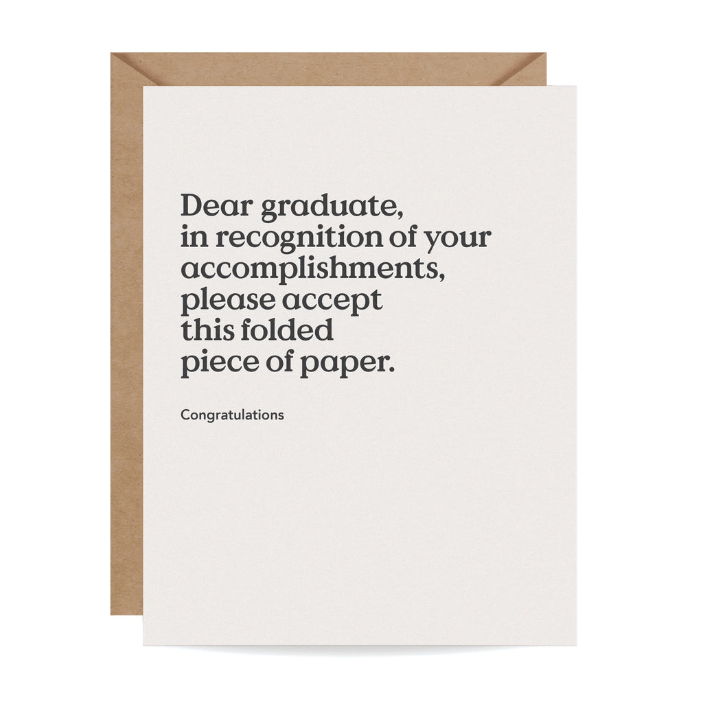 Greeting card with the following caption: "Dear graduate, in recognition of your accomplishments, please accept this folded piece of paper. Congratulations."