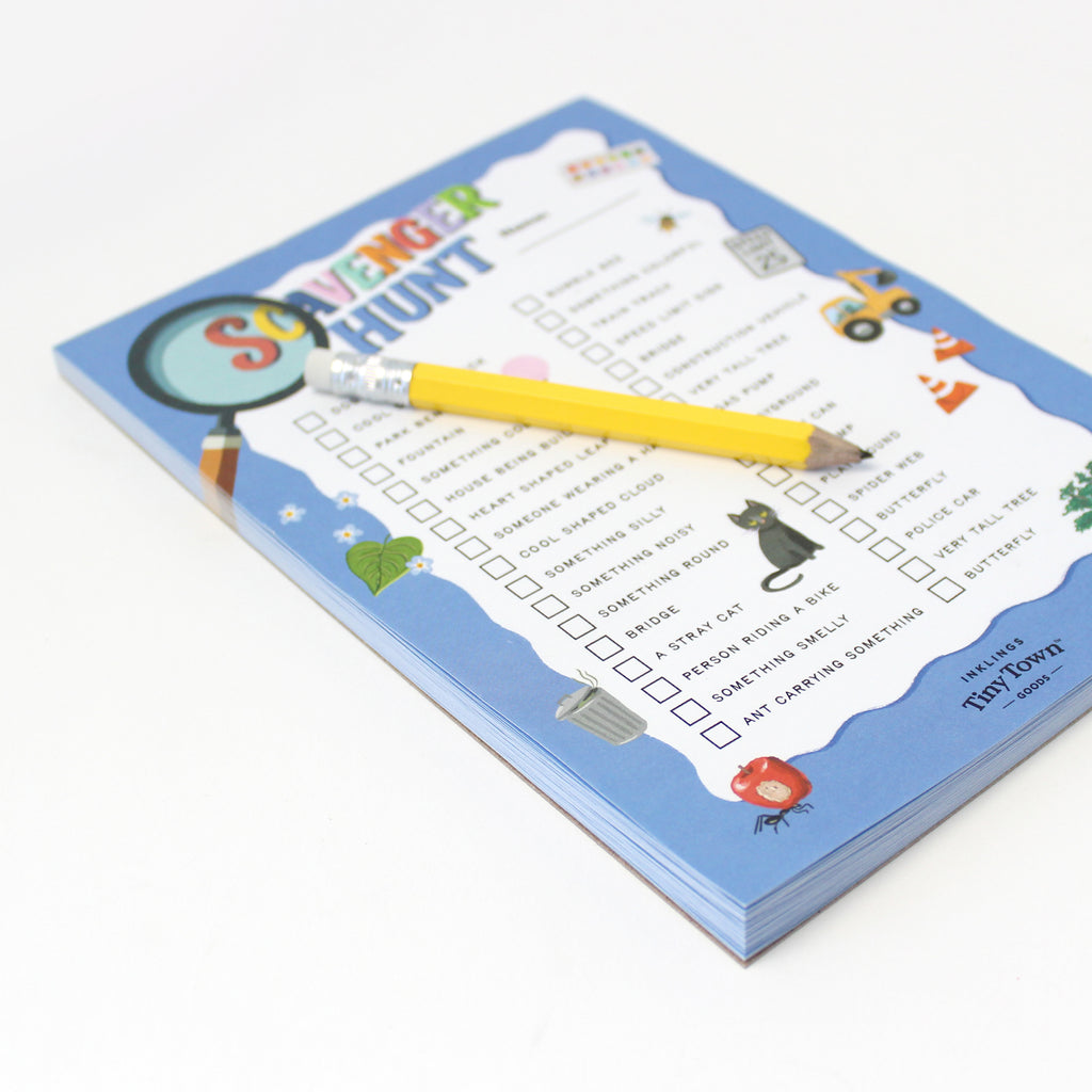 Close-up of Scavenger Hunt notepad page with activity prompts and yellow mini pencil